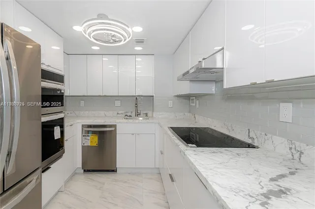 a kitchen with a sink stove and cabinets