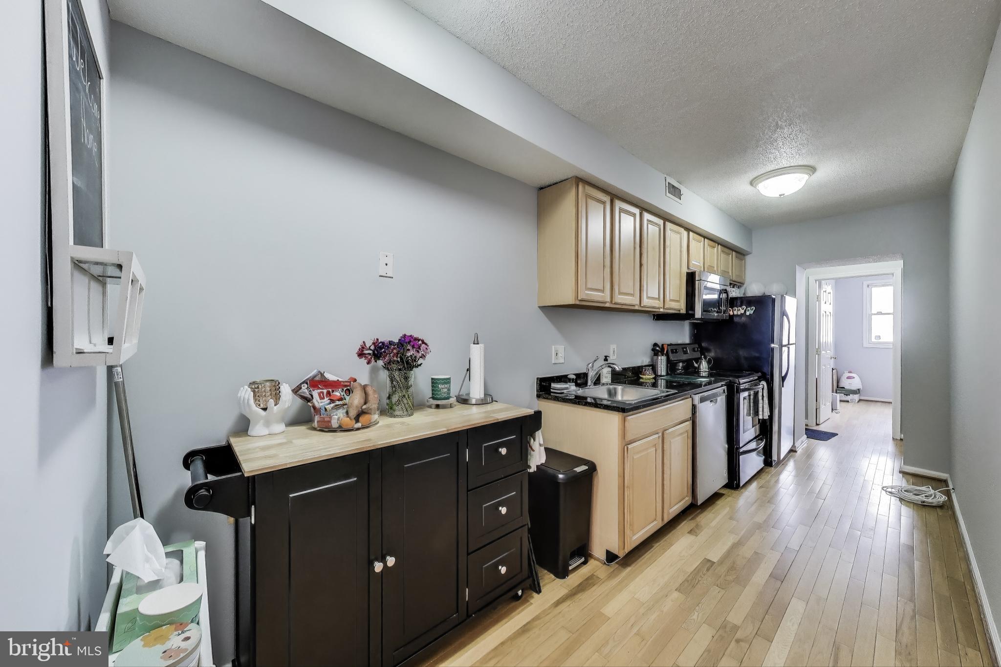 2817 7th Street Northeast, Unit 2 Washington, DC 20017 - Photo 6 of 16 Galley Kitchen with Table or Storage Space