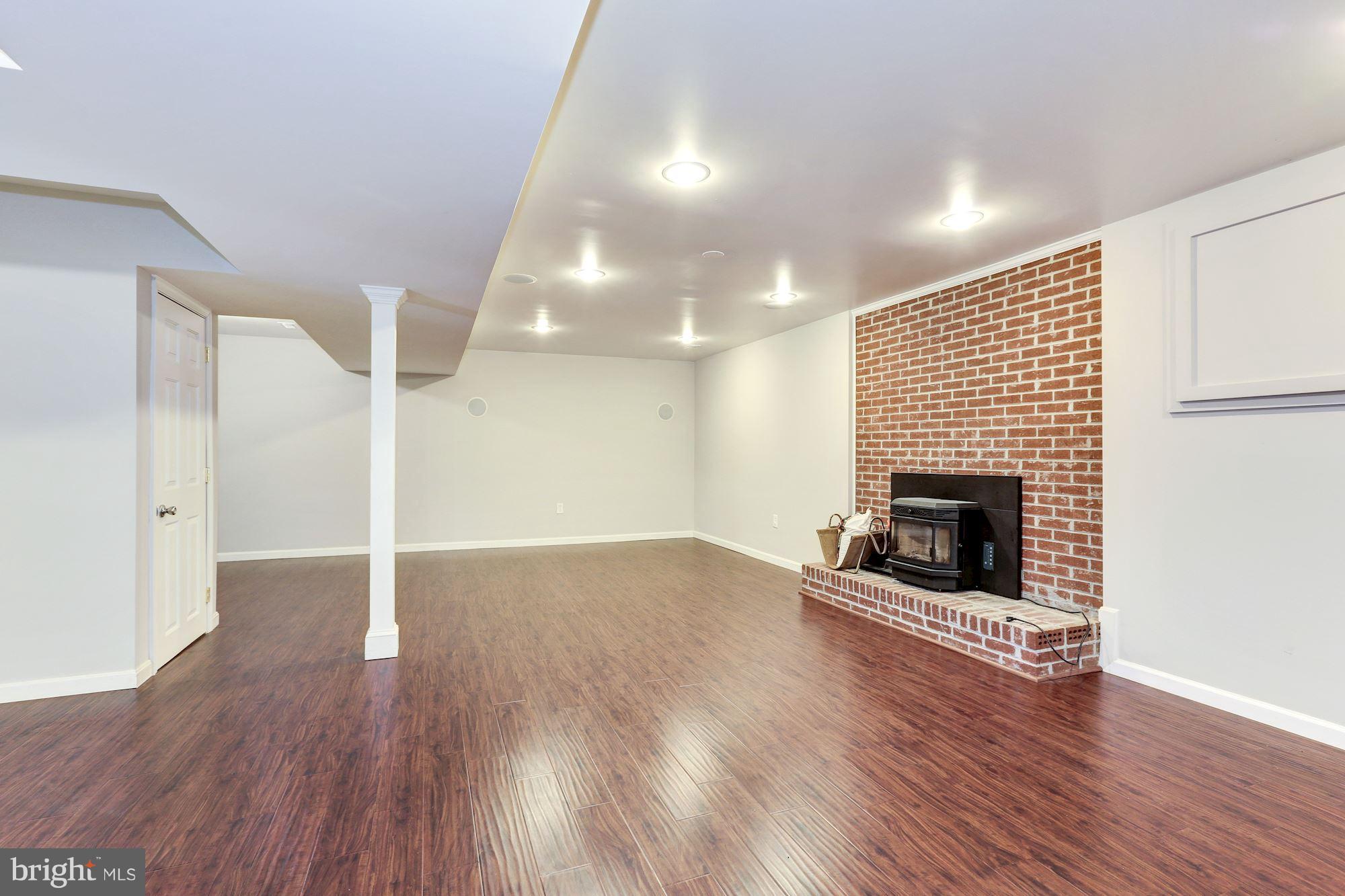 7982 Counselor Road Manassas, VA 20112 - Photo 25 of 30 Lower Level Rec room with pellet fireplace