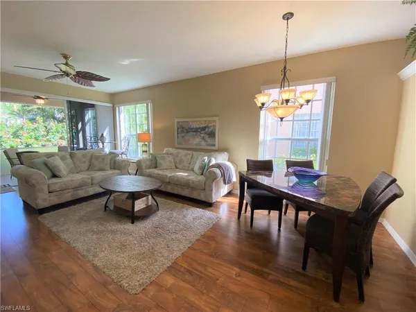 a living room with furniture and a table