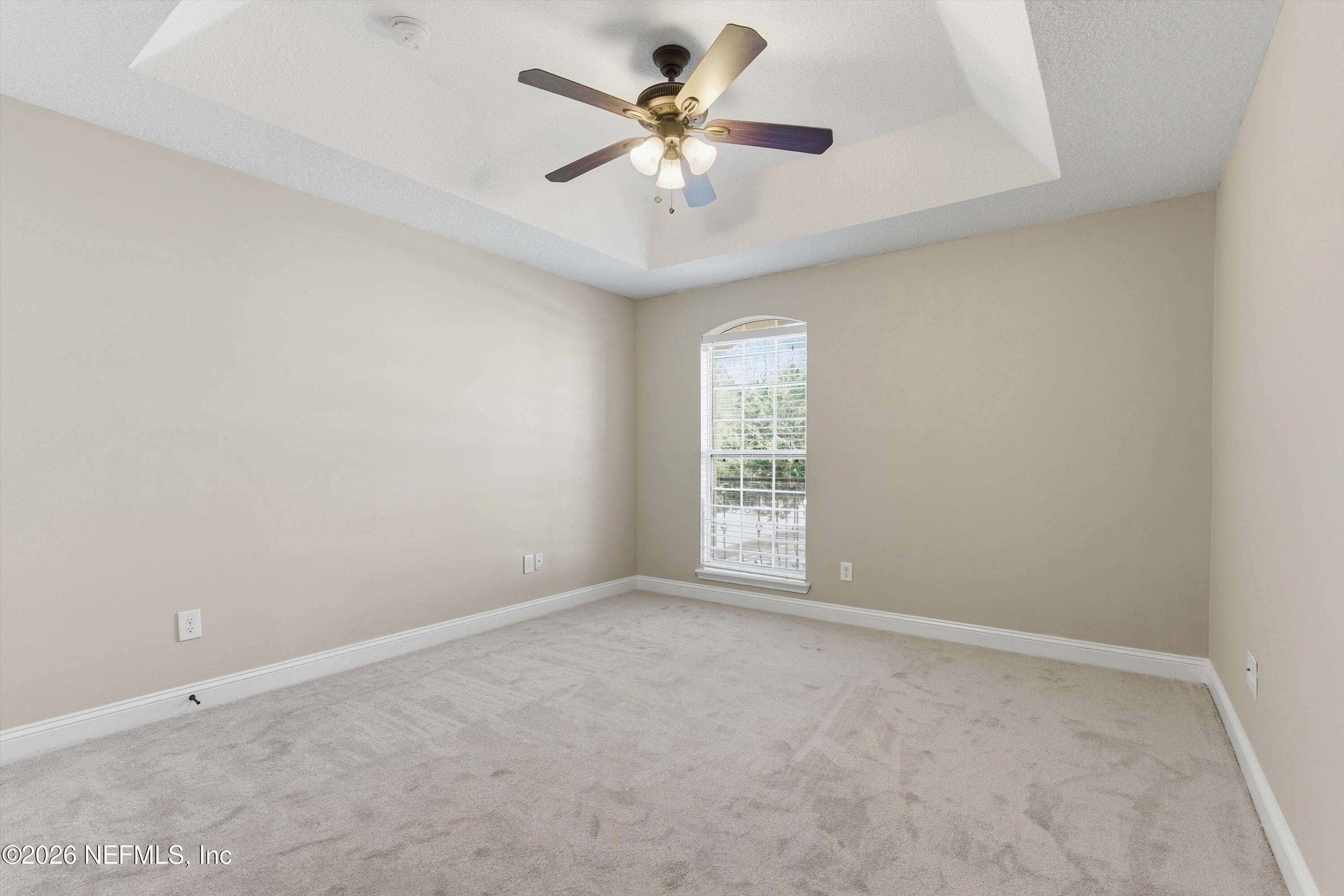 1733 Sanctuary Way Fleming Island, FL 32003 - Photo 28 of 39 a view of an empty room with a window