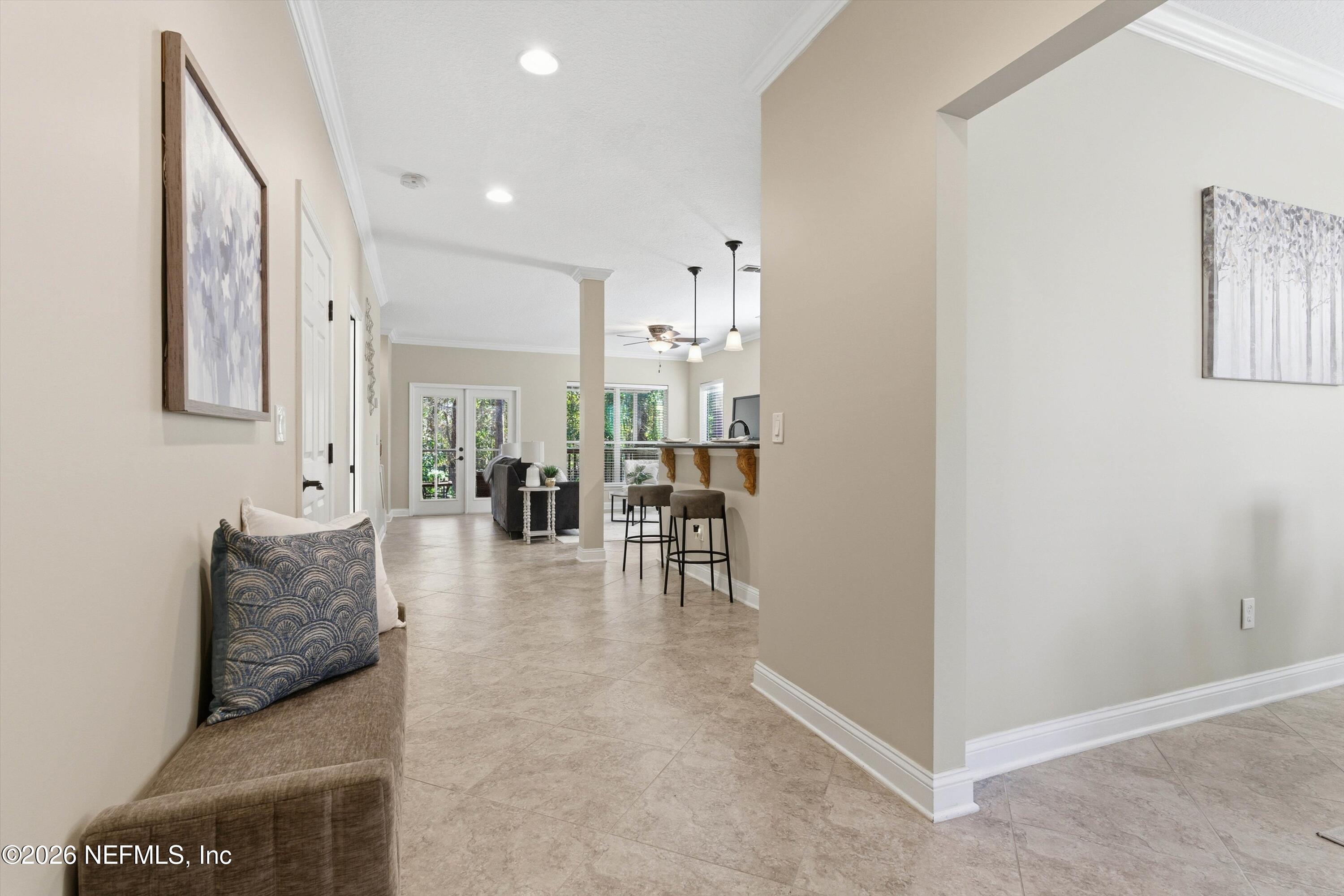 1733 Sanctuary Way Fleming Island, FL 32003 - Photo 3 of 39 a living room with furniture and a table