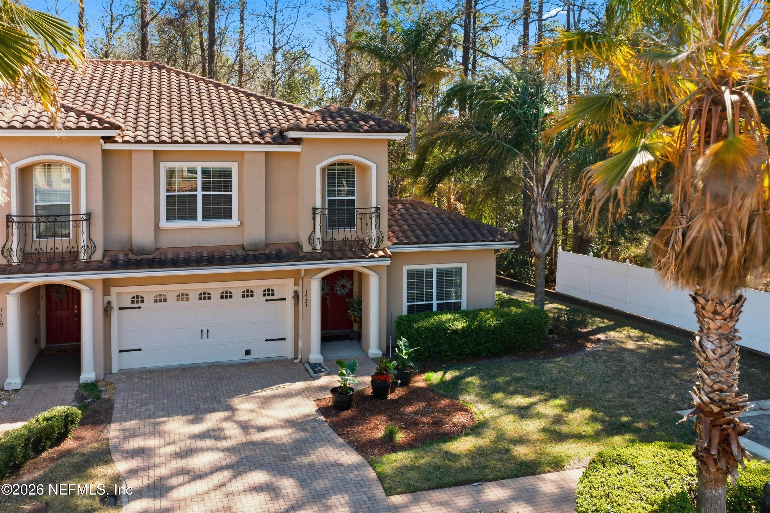 1733 Sanctuary Way Fleming Island, FL 32003 - Photo 37 of 39 a front view of a house with a garden