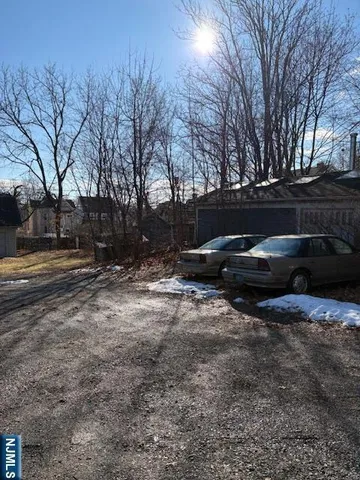 a view of a backyard of the house