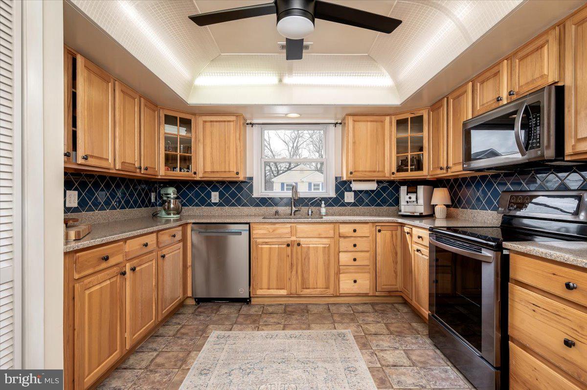 330 Londontown Road Edgewater, MD 21037 - Photo 18 of 61 a kitchen with stainless steel appliances granite countertop a stove sink and cabinets