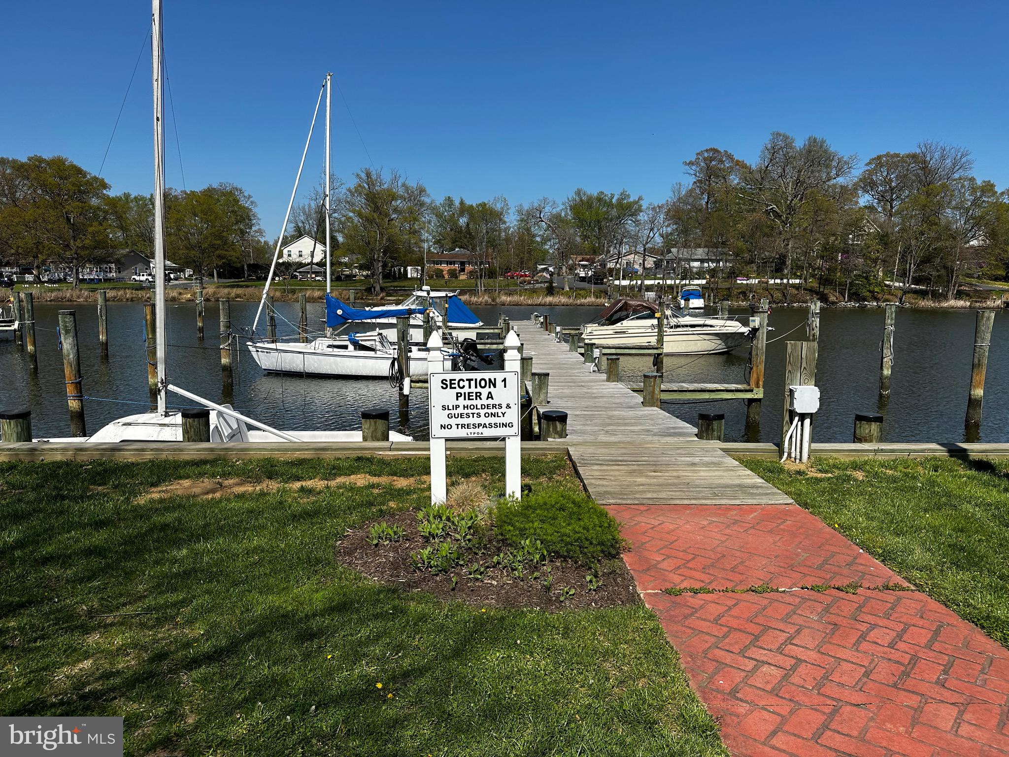 330 Londontown Road Edgewater, MD 21037 - Photo 46 of 61 a view of a lake with boats and palm trees