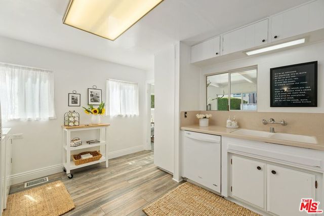a bathroom with a sink double vanity and a mirror