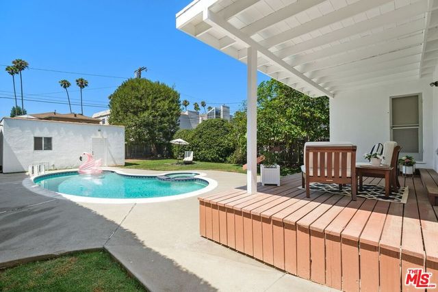 a view of a patio with a table chairs and a patio