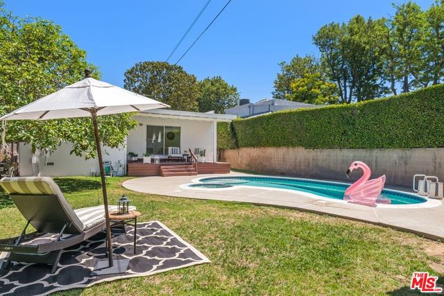 a view of a swimming pool with a patio
