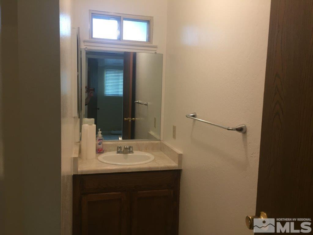 1336 Canyon Creek Road Reno, NV 89523 - Photo 11 of 32 a bathroom with a sink and a mirror