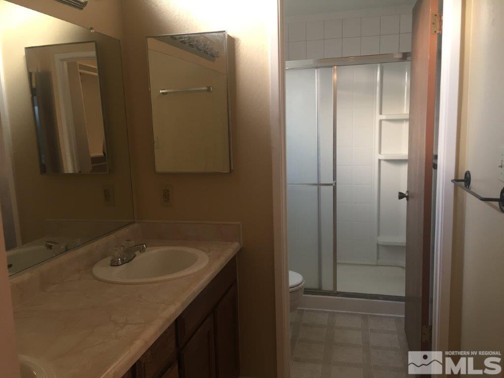 1336 Canyon Creek Road Reno, NV 89523 - Photo 16 of 32 a bathroom with a sink and mirror