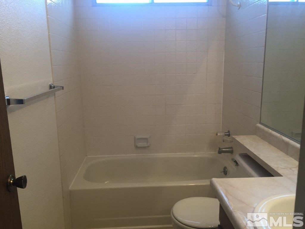 1336 Canyon Creek Road Reno, NV 89523 - Photo 22 of 32 a bathroom with a toilet and a bath tub