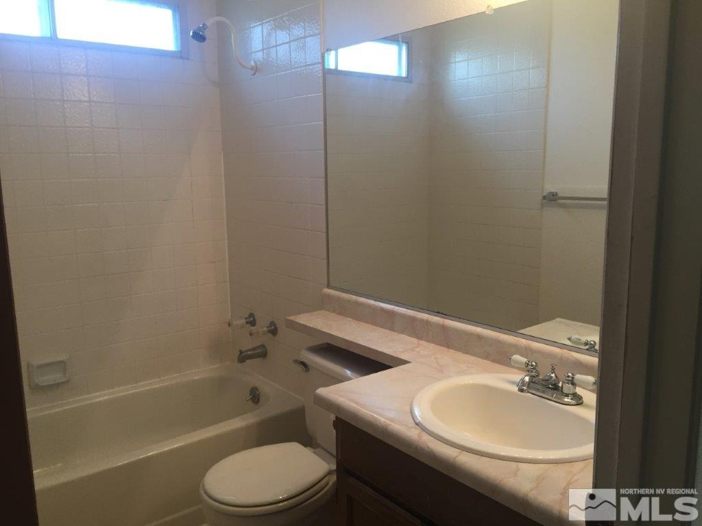 1336 Canyon Creek Road Reno, NV 89523 - Photo 23 of 32 a bathroom with a sink toilet and shower
