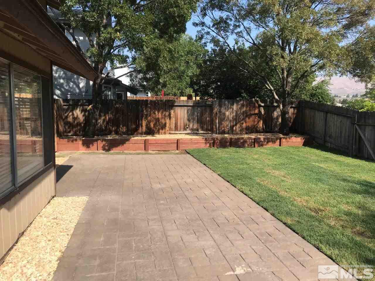 1336 Canyon Creek Road Reno, NV 89523 - Photo 30 of 32 a view of a backyard with a garden