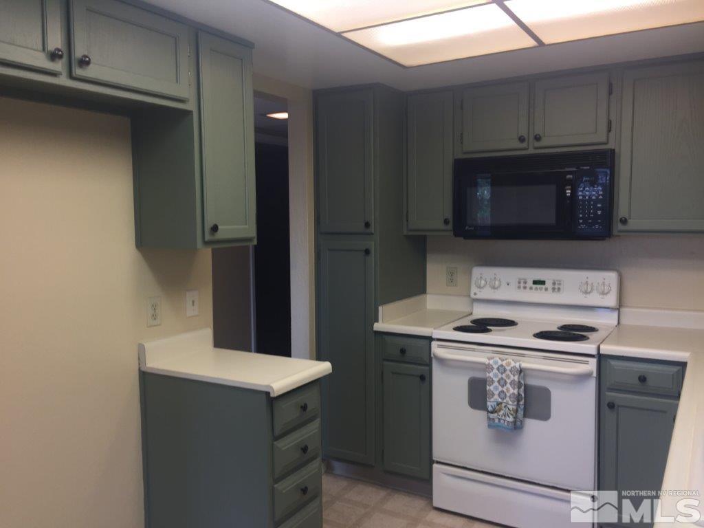 1336 Canyon Creek Road Reno, NV 89523 - Photo 4 of 32 a kitchen with a stove and a microwave