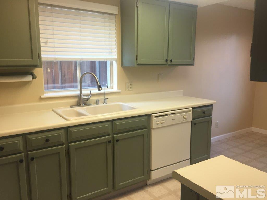 1336 Canyon Creek Road Reno, NV 89523 - Photo 5 of 32 a kitchen with a sink cabinets and a window