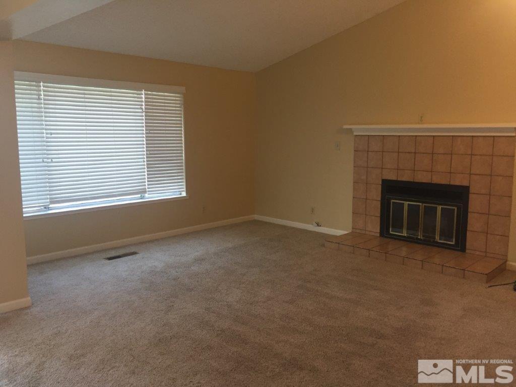 1336 Canyon Creek Road Reno, NV 89523 - Photo 9 of 32 a view of empty room with a fireplace