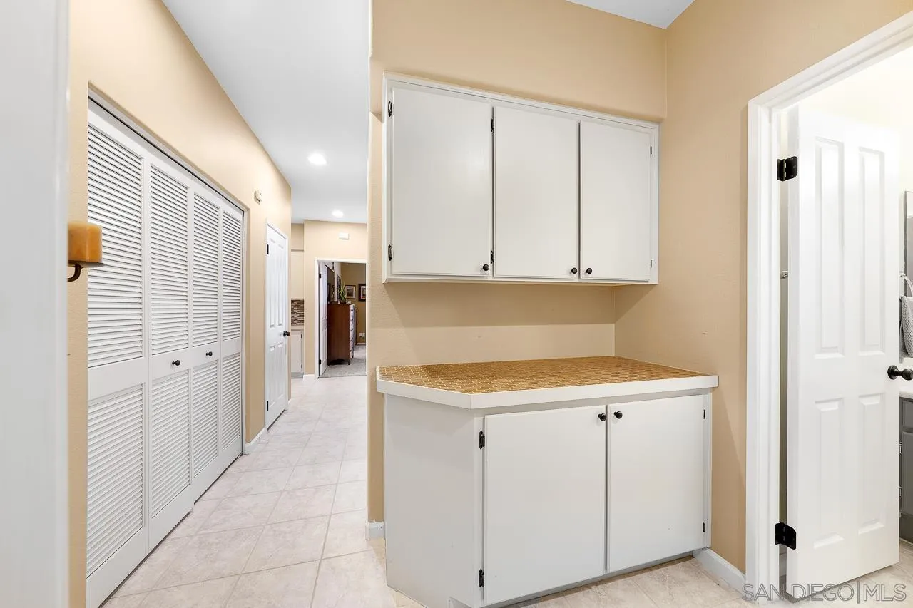 2460 Eagle Valley Drive Chula Vista, CA 91914 - Photo 15 of 35 a kitchen with a sink and cabinets