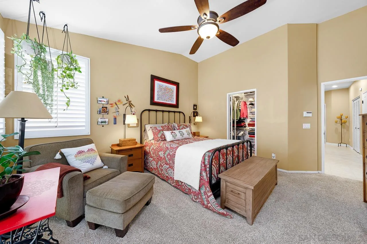 2460 Eagle Valley Drive Chula Vista, CA 91914 - Photo 18 of 35 a bedroom with bed and a chandelier