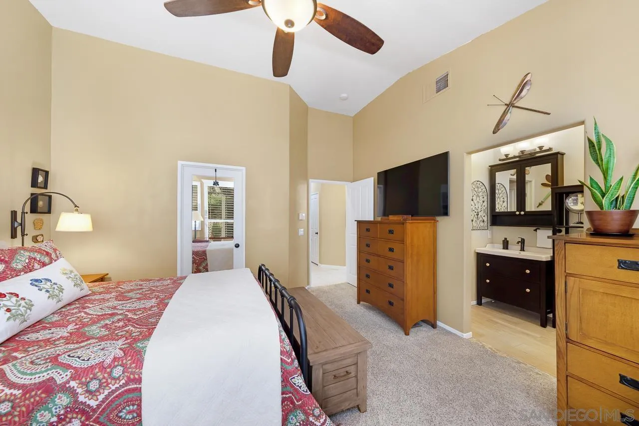 2460 Eagle Valley Drive Chula Vista, CA 91914 - Photo 19 of 35 a bedroom with a bed and flat screen tv