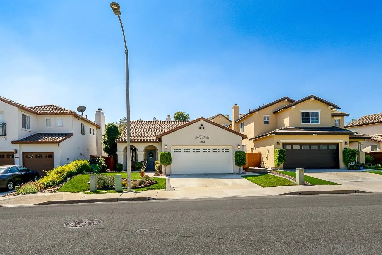 2460 Eagle Valley Drive Chula Vista, CA 91914 - Photo 2 of 35 a front view of a house with a garden and plants
