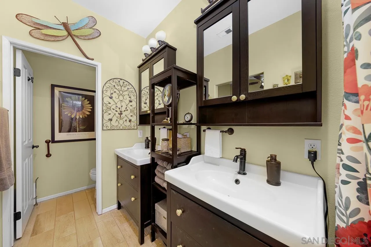 2460 Eagle Valley Drive Chula Vista, CA 91914 - Photo 21 of 35 a view of a kitchen area with furniture and wooden floor