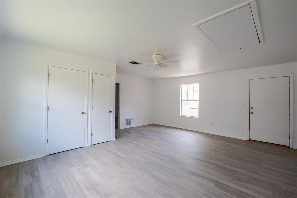 3126 Colgate Avenue Tyler, TX 75701 - Photo 27 of 33 a view of an empty room with wooden floor and a window