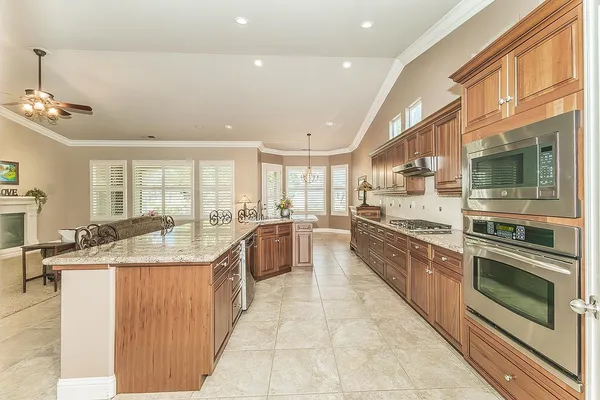 a view of a park with a house in the background