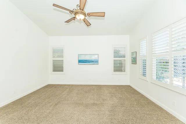 a bathroom with a sink vanity granite tub shower and a mirror
