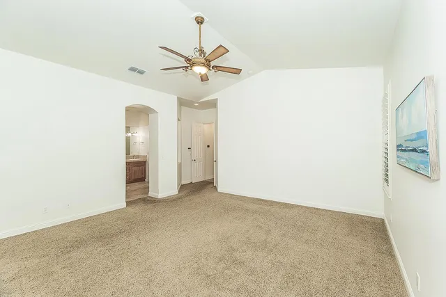 a bathroom with a toilet and a bath tub