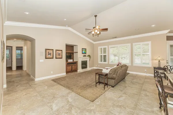 a bathroom with a sink vanity granite tub shower and a mirror