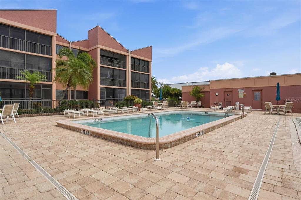 3170 Matecumbe Key Road, Unit 127 Punta Gorda, FL 33955 - Photo 22 of 22 a view of a swimming pool with a patio