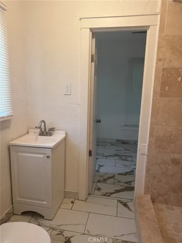 a bathroom with a sink and mirror
