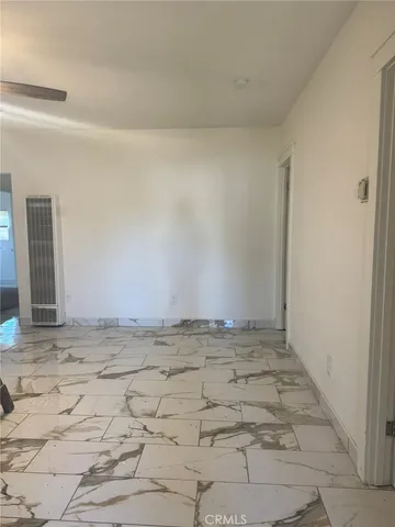 a view of a livingroom with wooden floor