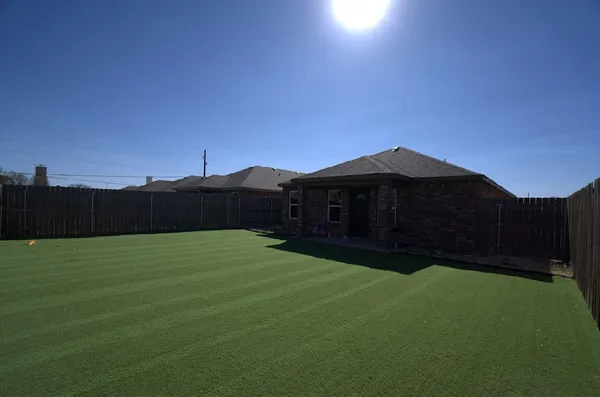 a house view with a garden space