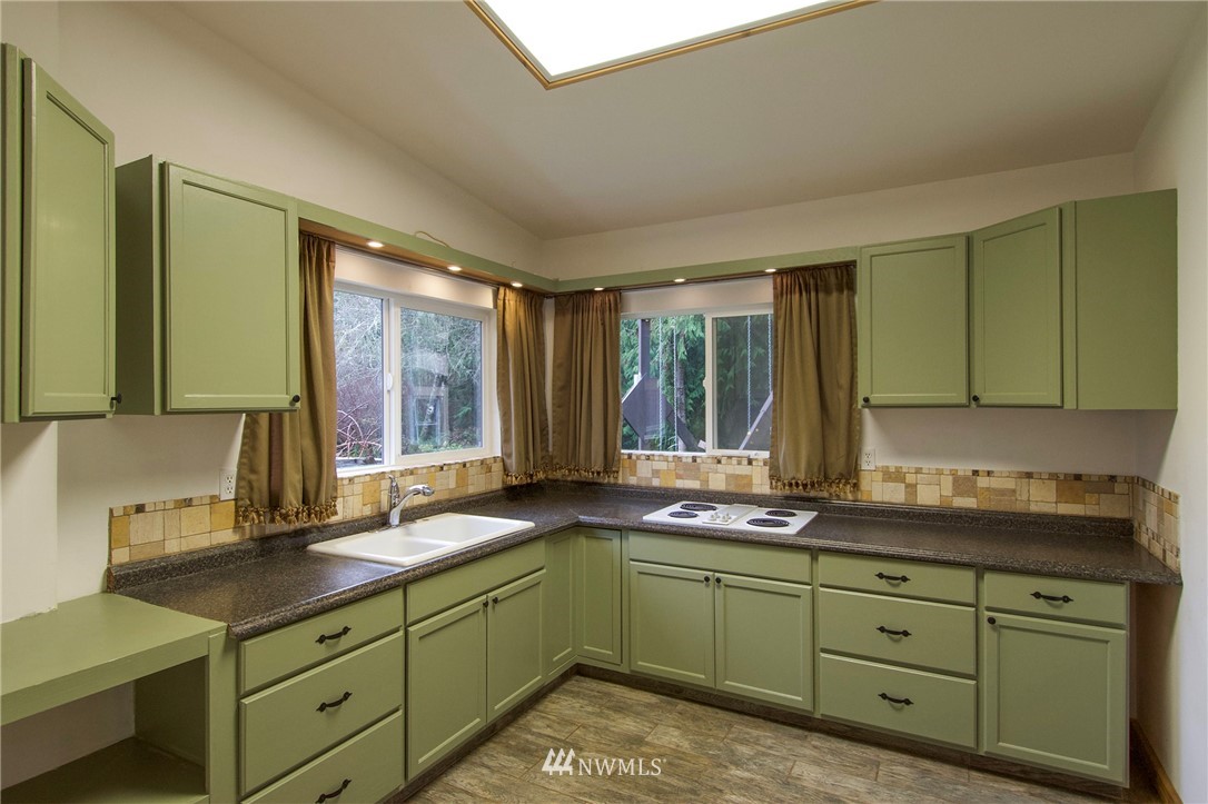 463 Autumn Road Sequim, WA 98382 - Photo 11 of 40 a kitchen with sink and large window
