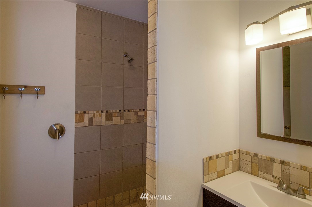 463 Autumn Road Sequim, WA 98382 - Photo 14 of 40 a bathroom with a sink and shower