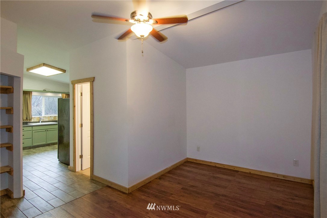 463 Autumn Road Sequim, WA 98382 - Photo 17 of 40 an empty room with wooden floor and a ceiling fan