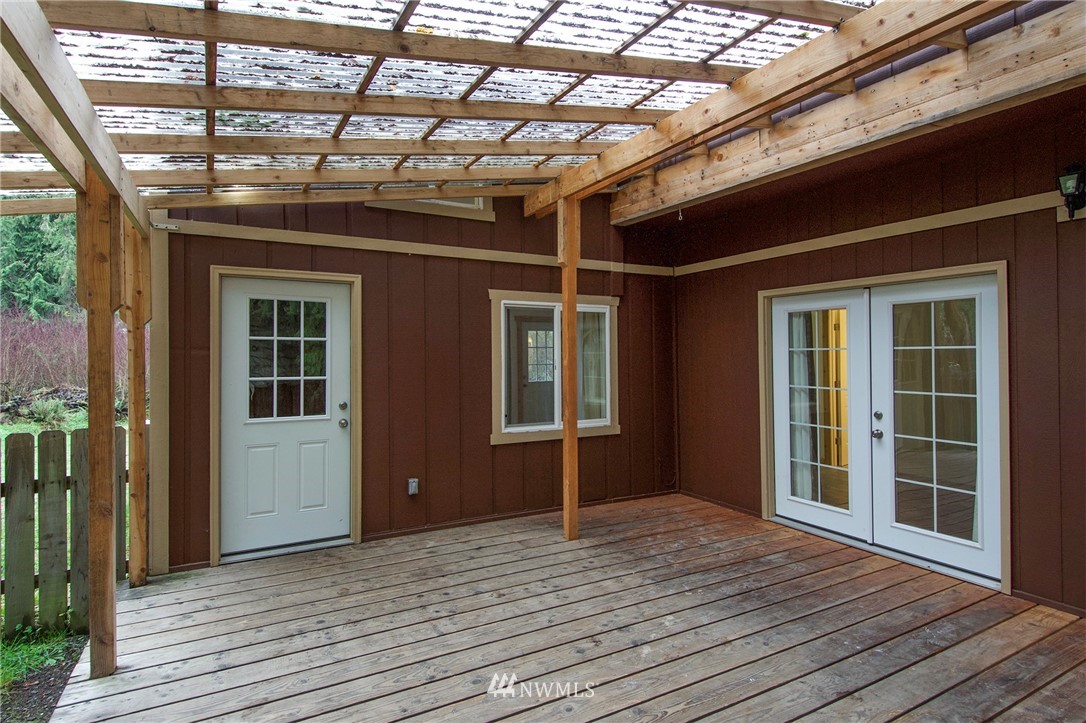463 Autumn Road Sequim, WA 98382 - Photo 20 of 40 a view of livingroom with wooden floor and fence