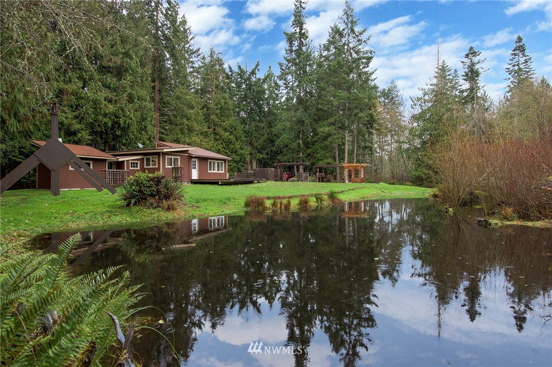 463 Autumn Road Sequim, WA 98382 - Photo 3 of 40 a view of a lake with a house in a yard
