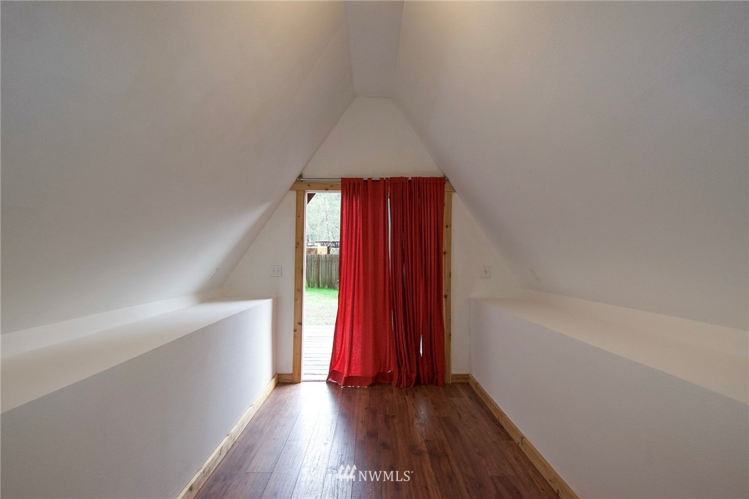 463 Autumn Road Sequim, WA 98382 - Photo 23 of 40 a view of a room with wooden floor and a window