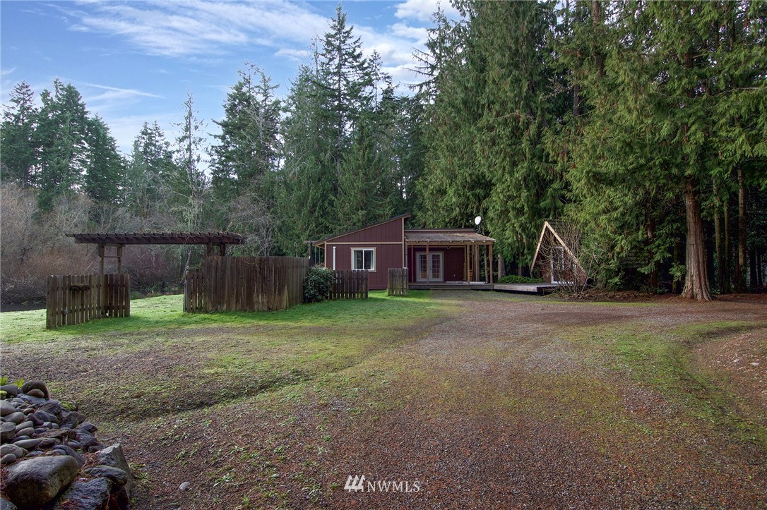 463 Autumn Road Sequim, WA 98382 - Photo 24 of 40 a view of a wooden house with a yard