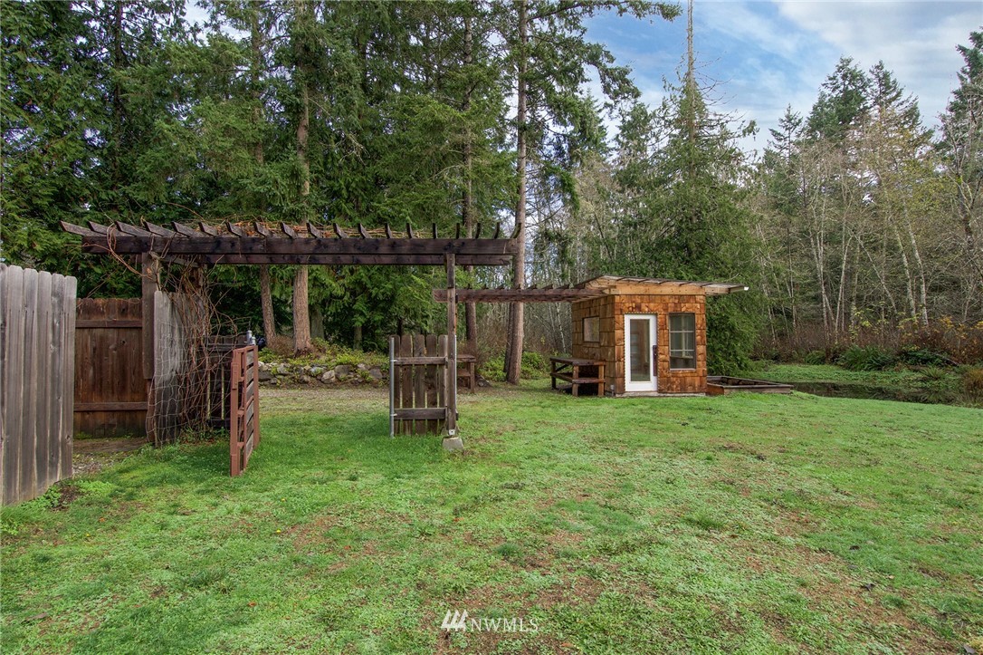 463 Autumn Road Sequim, WA 98382 - Photo 26 of 40 a view of a house with backyard and a patio