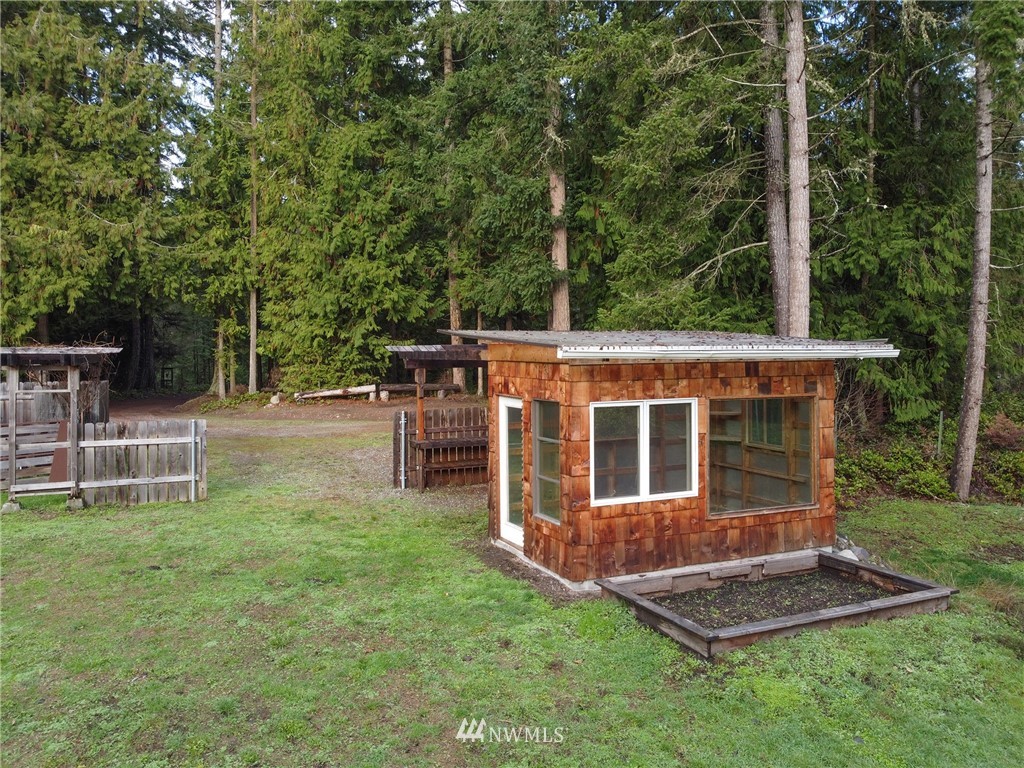 463 Autumn Road Sequim, WA 98382 - Photo 29 of 40 a view of house with backyard and seating area