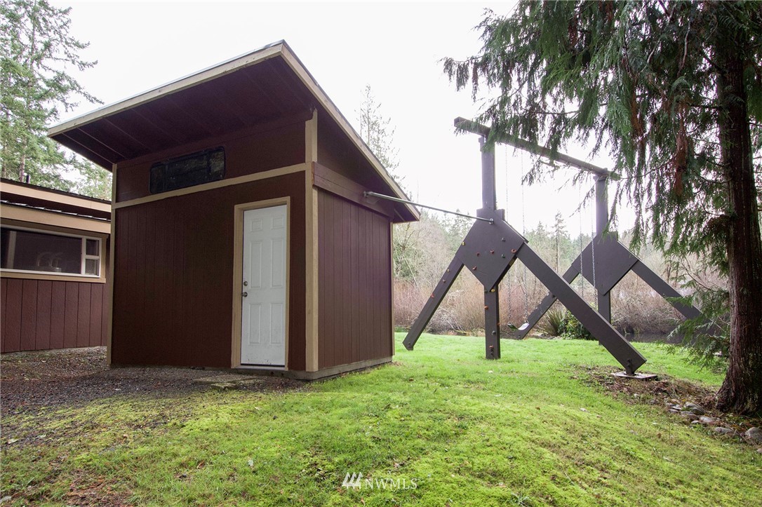 463 Autumn Road Sequim, WA 98382 - Photo 30 of 40 a view of an house with backyard and a tree