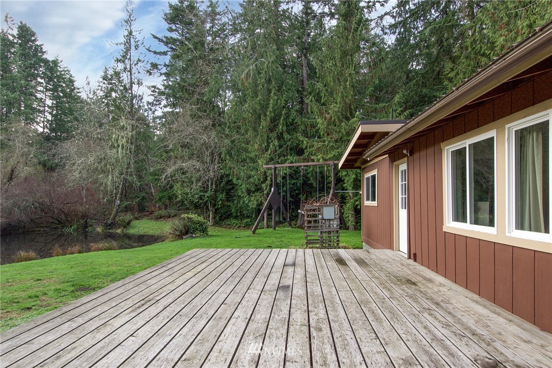 463 Autumn Road Sequim, WA 98382 - Photo 4 of 40 a view of backyard with a deck and wooden floor