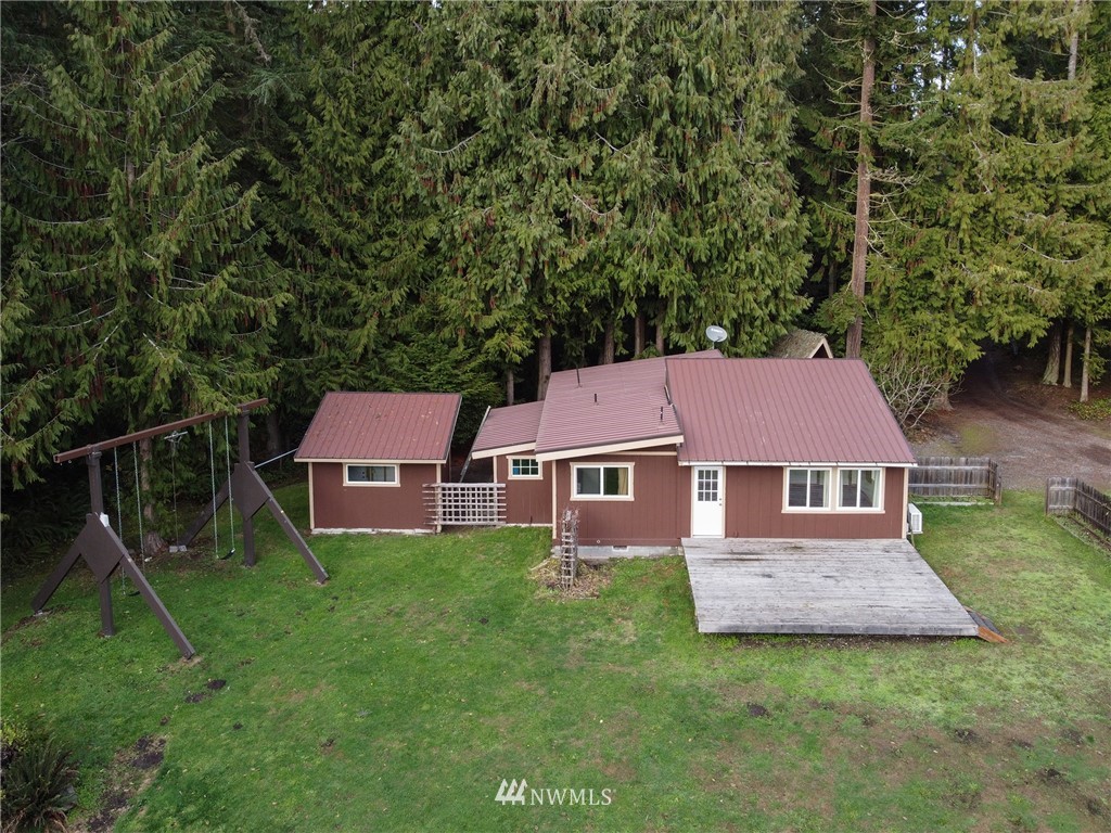 463 Autumn Road Sequim, WA 98382 - Photo 36 of 40 an aerial view of a house with swimming pool and garden