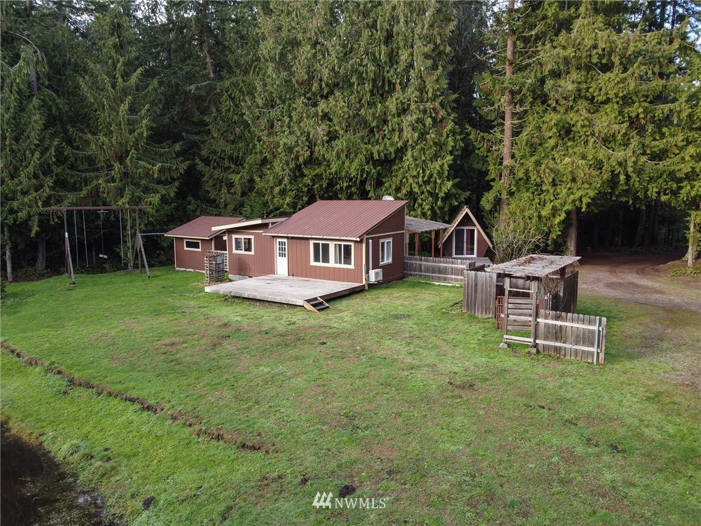 463 Autumn Road Sequim, WA 98382 - Photo 37 of 40 a house view with a sitting space and garden