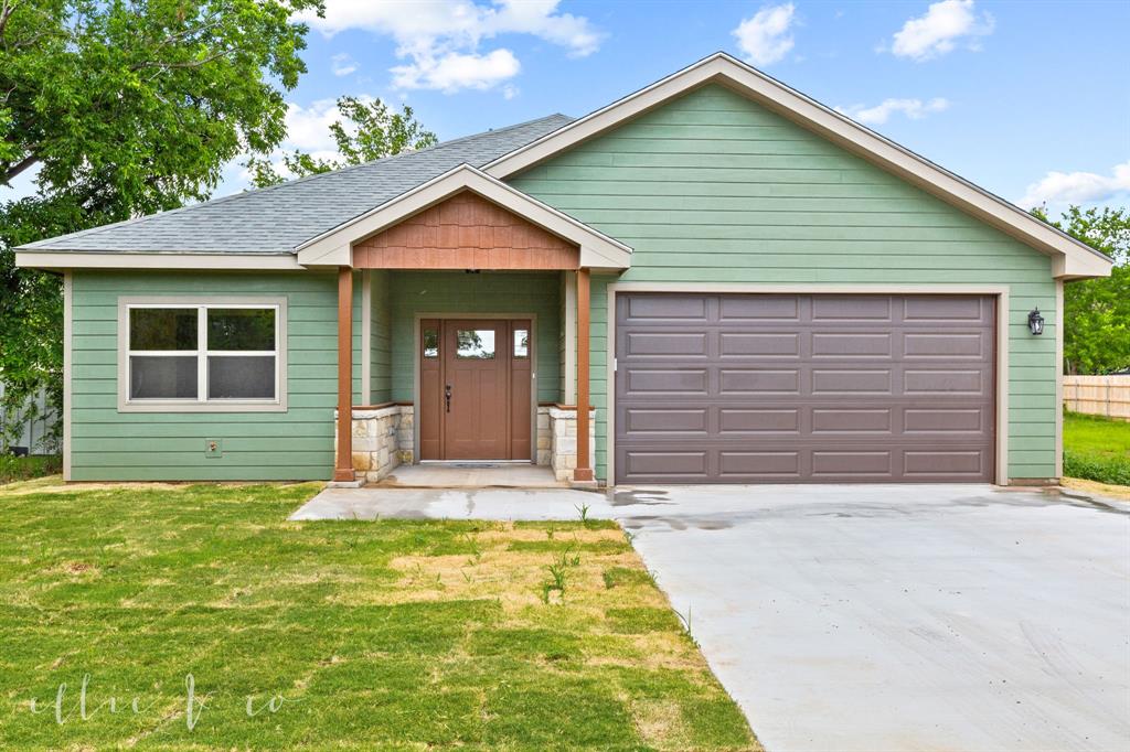 a front view of house with yard
