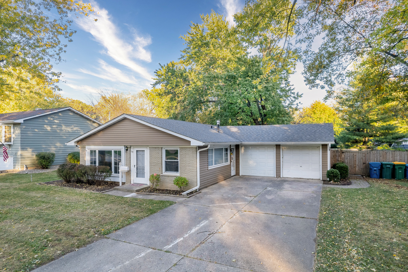 59 Briarcliff Road Montgomery, IL 60538 - Photo 1 of 34 a front view of a house with a garden